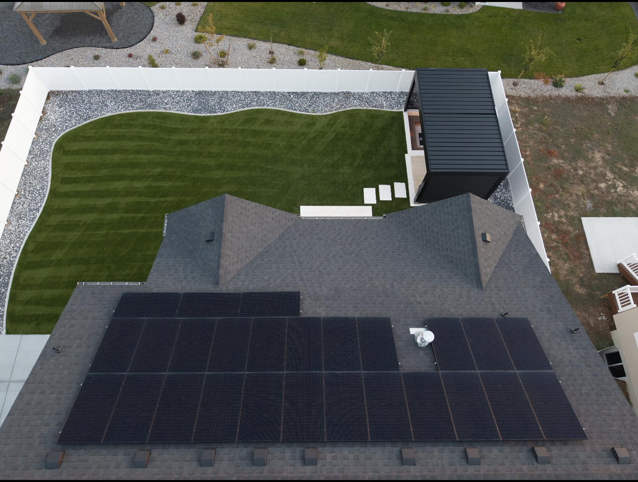 Aerial view of home with solar panels
