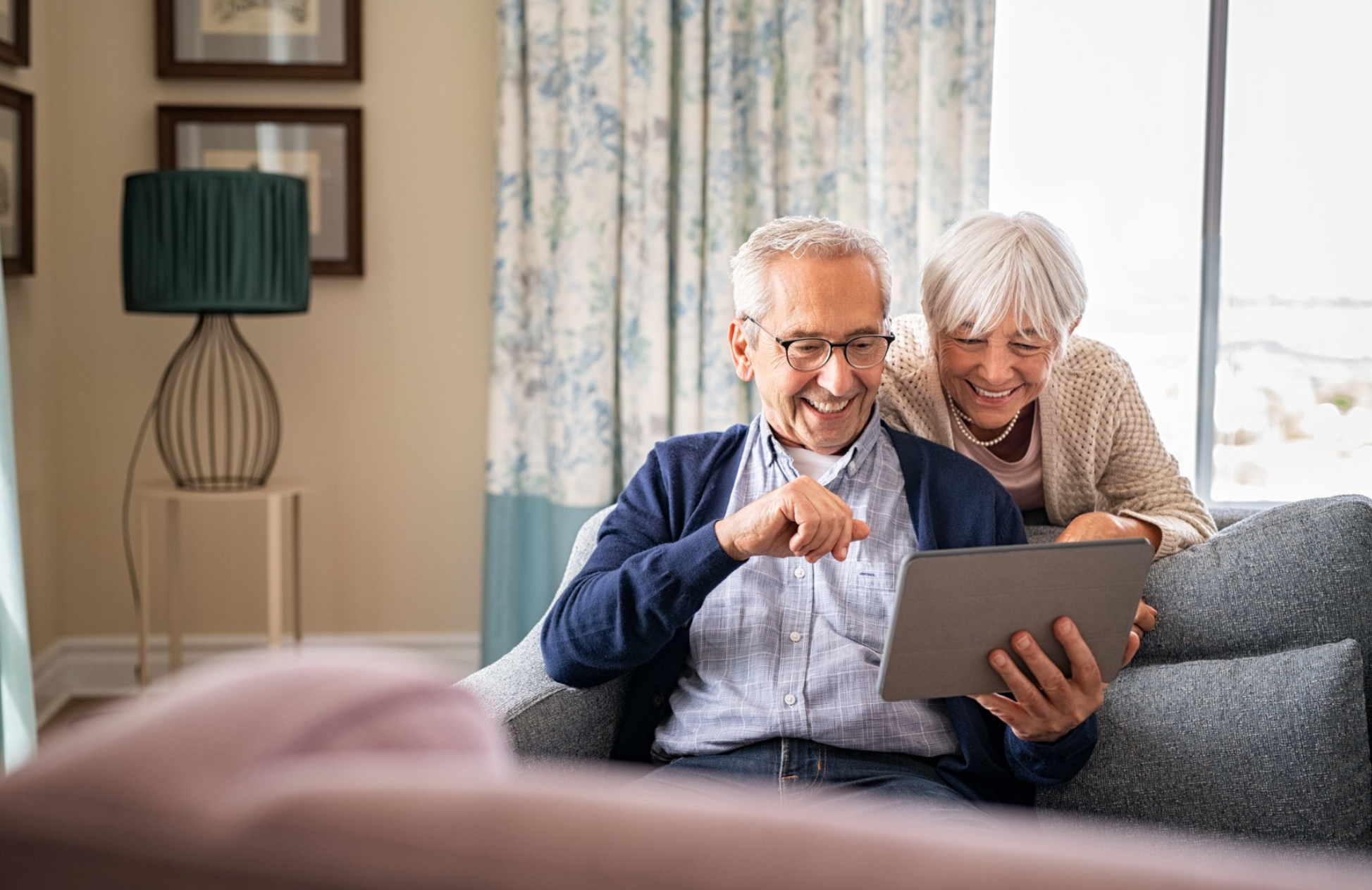Couple shopping for solar on tablet