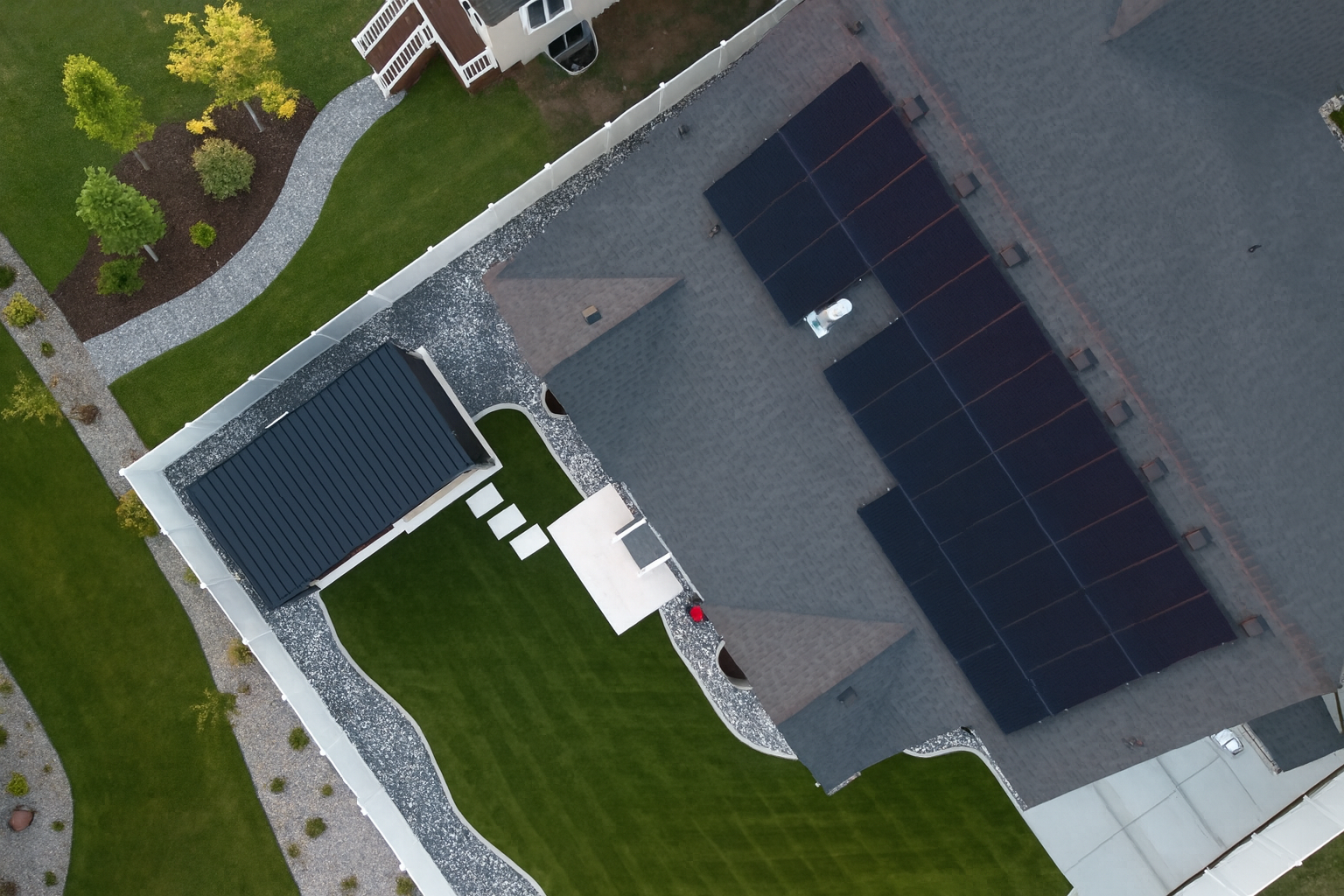 Aerial view of home with solar panels installed